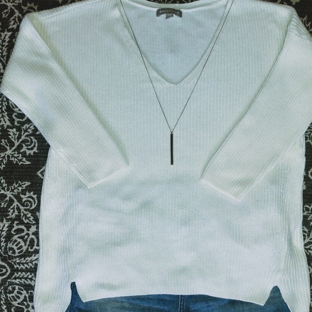 White sweater.
